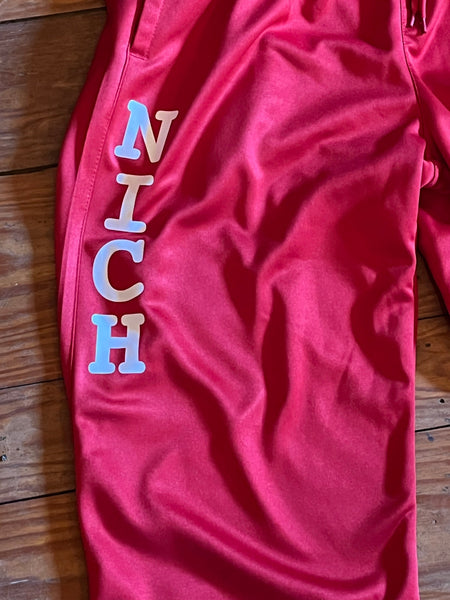 Red sweatpants with NICH Logo
